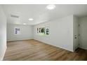 Bright living room featuring wood floors, recessed lighting, and large windows at 4221 Haverhill Dr, Anderson, IN 46013