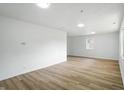 Empty Living Room features wood floors, recessed lighting, and neutral paint at 4221 Haverhill Dr, Anderson, IN 46013