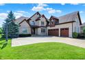 Stunning two-story brick home featuring a three-car garage, mature landscaping, and a basketball hoop at 4931 Kerrington Blvd, Bargersville, IN 46106