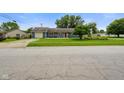 Inviting single-story home with a well-manicured lawn and charming curb appeal at 50 Crestview Dr, Greenwood, IN 46143