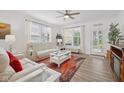Comfortable living room with neutral furniture, a ceiling fan, and abundant natural light at 624 Faudree Dr, Westfield, IN 46074