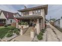 Inviting exterior of a two-story home with a welcoming front porch and manicured landscaping at 629 S Miller St, Shelbyville, IN 46176