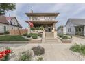 Attractive two-story home featuring a well-manicured front yard and welcoming entrance at 629 S Miller St, Shelbyville, IN 46176