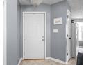Light and airy entryway featuring tile flooring, a coat closet, and gray paint at 6637 Sundown S Dr, Indianapolis, IN 46254