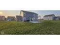 Home featuring a well-maintained yard and concrete patio at 6842 Arrowhead Dr, Brownsburg, IN 46112