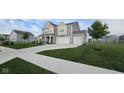 Inviting home with a well-maintained lawn, complemented by a three car attached garage at 6842 Arrowhead Dr, Brownsburg, IN 46112
