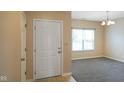 The front entrance showcases the light-filled area leading into other rooms at 7715 Bolero Dr, Camby, IN 46113