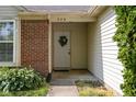 Inviting front entrance with a wreath and address number above the door at 779 Alvey Ct, Greenwood, IN 46143