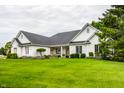 Beautiful one-story home showcasing its manicured lawn, mature trees, and classic brick facade at 9678 Winter Way, Zionsville, IN 46077
