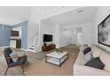 Spacious living room with hardwood floors, light-colored walls, and stylish furnishings at 10427 Apple Creek Dr, Indianapolis, IN 46235