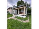 Charming single-Gathering home features a cozy front porch and inviting curb appeal at 1354 Edgemont Ave, Indianapolis, IN 46208