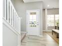 Bright foyer with natural light, showcasing staircase and front door view at 278 Evening Bay Ct, Pendleton, IN 46064