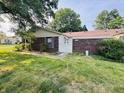 Charming single-story home with a brick facade and a well-maintained lawn with healthy green grass at 4408 Clovelly Ct, Indianapolis, IN 46254