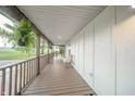 Spacious covered porch with an open design and views of the surrounding green landscape at 4491 W 600 N, Anderson, IN 46011