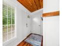 Bright foyer features wood floors, two entry doors, a window, and a coat rack at 460 W Hinshaw Dr, Nineveh, IN 46164