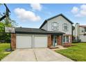 Charming two-story home with a two-car garage and a basketball hoop in the driveway at 4749 Rocky Knob Ln, Indianapolis, IN 46254