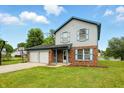 Charming two-story home with a two-car garage and a basketball hoop in the driveway at 4749 Rocky Knob Ln, Indianapolis, IN 46254