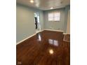 Bright living area featuring hardwood floors, neutral paint, and natural light at 4908 Elmhurst Dr, Indianapolis, IN 46226