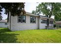 Attractive single-story home with a spacious lawn and inviting front entrance at 517 N Leland St, Fortville, IN 46040
