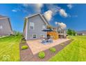 Relaxing backyard patio with comfortable seating, perfect for outdoor entertaining and leisure at 5199 Green Valley Ln, Noblesville, IN 46062