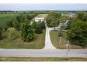 Spacious property with a long driveway, barn, and lush green fields, offering privacy and rural charm at 5538 N 700 W, McCordsville, IN 46055