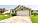 Well-maintained home with an attached two-car garage and neat landscaping with a black star on the front at 7639 Foxglove Ln, Noblesville, IN 46062