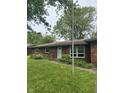 Ranch home with brick and nice big front yard that need some landscaping at 8312 Lamira Ln, Indianapolis, IN 46234