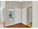 Welcoming entryway featuring hardwood floors, a window for natural light, and access to other rooms at 9055 Glass Chimney Ln, Fishers, IN 46037