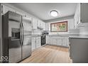 Well-lit kitchen showcasing white cabinets, stainless steel appliances, and granite countertops at 110 Leichester Ct, Noblesville, IN 46060
