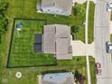 Aerial shot of backyard showing a deck, pergola, and green lawn in a fenced yard at 1306 Avocet Dr, Greenwood, IN 46143