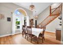 Elegant dining room with large windows, natural light, and beautiful hardwood floors at 2384 Fairfax Dr, Columbus, IN 47203