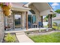 Inviting front porch with cozy seating and tasteful decor; perfect for relaxing and enjoying the outdoors at 2384 Fairfax Dr, Columbus, IN 47203