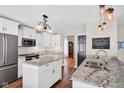 Modern kitchen featuring stainless steel appliances, granite countertops, and ample cabinet space at 2384 Fairfax Dr, Columbus, IN 47203