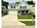 Two-story home with a two car garage, brick and siding accents, and a well maintained lawn at 3314 Montgomery Dr, Indianapolis, IN 46227