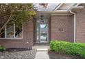 Inviting front entrance with brick facade, house number, and landscaped bushes at 3545 Inverness Blvd, Carmel, IN 46032
