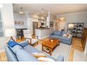 Open living room and kitchen featuring hardwood floors and modern decor at 355 E Ohio St # 211, Indianapolis, IN 46204