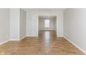 Bright and spacious living room featuring hardwood floors and neutral paint at 413 Youngs Creek Ct, Franklin, IN 46131