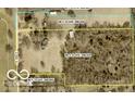 This aerial view showcases a large plot of land, ripe with potential for development or a private estate at 4633 S County Road 500 E, Plainfield, IN 46168