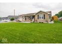 Single-story home with a spacious front lawn and inviting curb appeal at 524 W Campbell St, Edinburgh, IN 46124