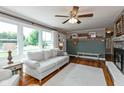 Bright living room with large windows, hardwood floors, comfortable seating, and charming decorative accents at 544 Everling Dr, Morgantown, IN 46160
