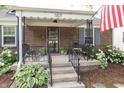 Inviting front porch with seating, perfect for relaxing outdoors at 5829 Indianola Ave, Indianapolis, IN 46220