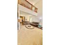 Spacious living room featuring high ceilings, neutral carpeting and a comfortable seating arrangement at 5924 Sable Dr, Indianapolis, IN 46221