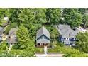 Overhead view of property showcasing the home's landscaped yard, front porch and lush greenery at 6107 Broadway St, Indianapolis, IN 46220