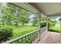View from the covered porch of a well-maintained lawn and mature trees at 6575 E 171St St, Noblesville, IN 46062