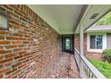 Welcoming front porch with brick flooring and an inviting entryway at 6575 E 171St St, Noblesville, IN 46062