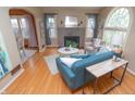 Bright living room featuring hardwood floors, fireplace, and comfortable seating, perfect for relaxation and entertaining at 828 N Butler Ave, Indianapolis, IN 46219