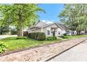 Cozy single-story home with well-maintained lawn and lush trees, enhanced by a brick walkway and tidy landscaping at 917 W Pearl St, Lebanon, IN 46052