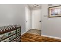 Welcoming entryway features wood flooring and a decorative chest of drawers at 9520 Settlement W Dr, Indianapolis, IN 46250
