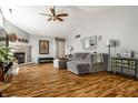 Bright living room boasts wood floors, vaulted ceilings, and a stone fireplace at 9520 Settlement W Dr, Indianapolis, IN 46250