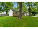 Charming single-story brick home with a well-manicured lawn and mature shade trees at 99 Old Trail Dr, Bargersville, IN 46106